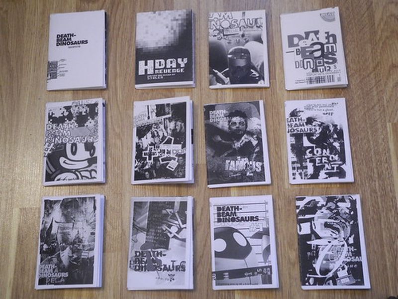 A grid of Death-Beam Dinosaur zines
